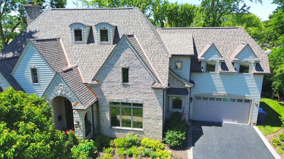 residential home with new shingle roofing system installation