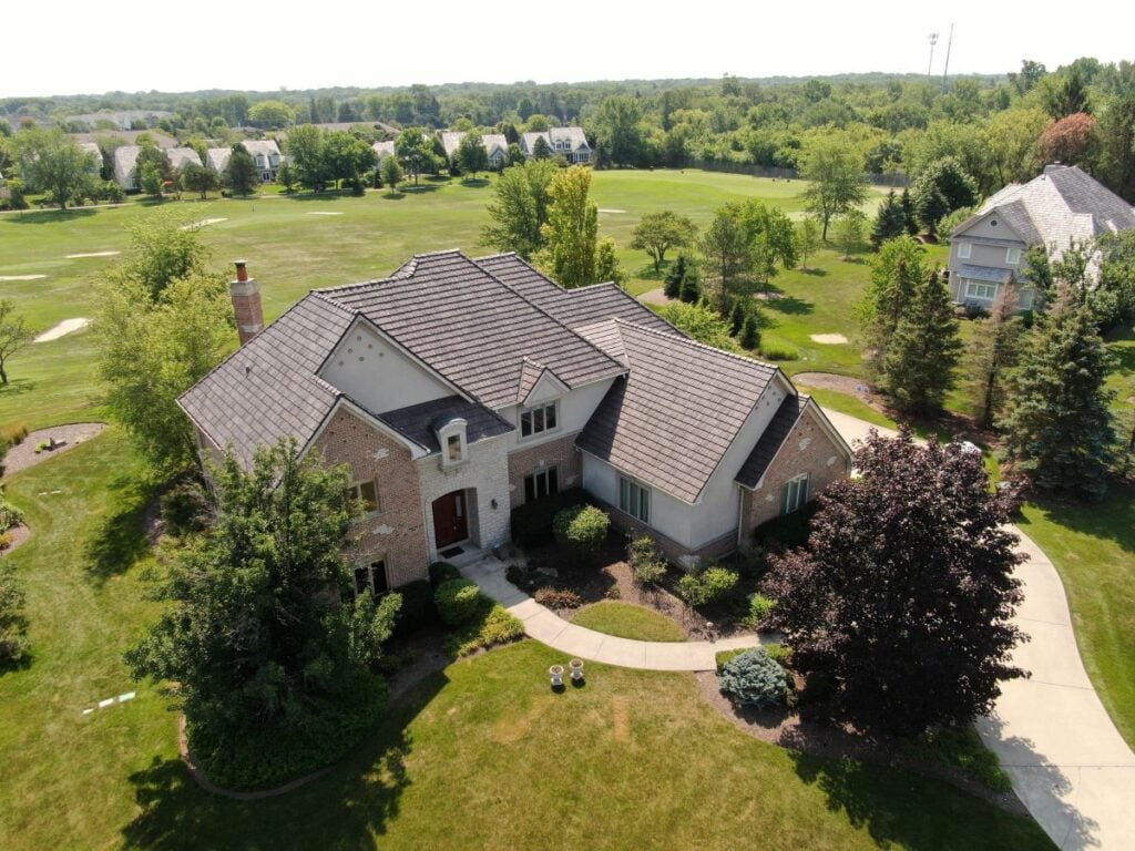 Aerial view of a large house with a slate roof