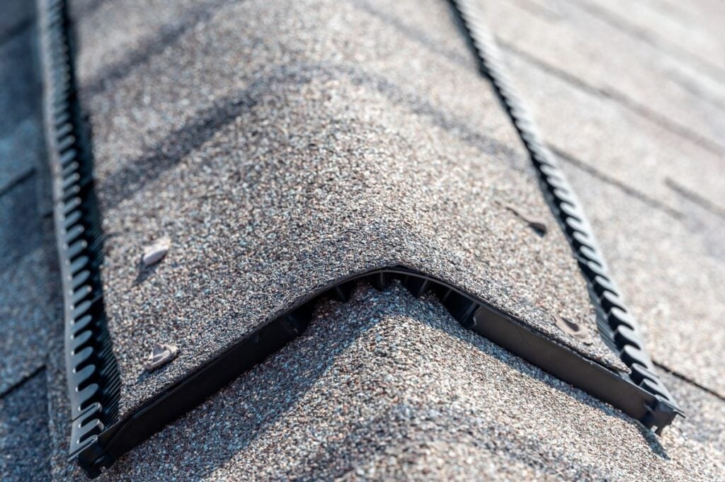 Ridge cap vent installed on a shingle roof