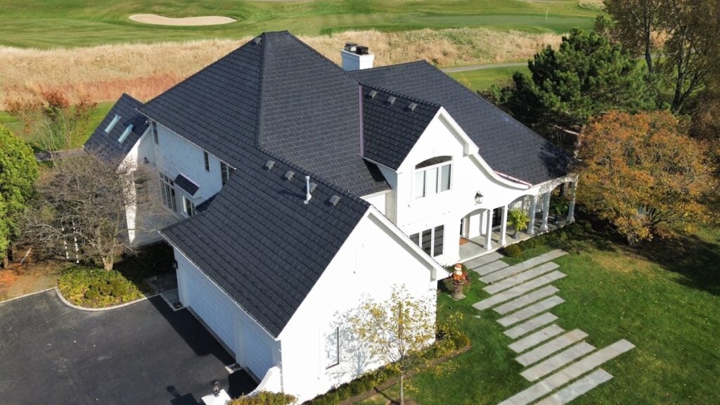 Black composite roofing solution on a white house