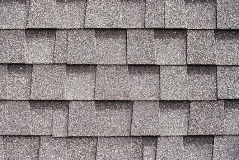 Gray shingles for covering the roof. Building material flexible tile background.