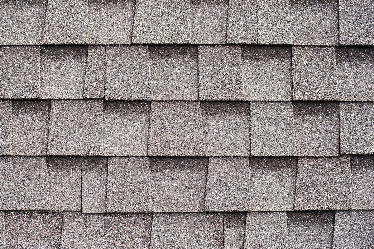 Gray shingles for covering the roof. Building material flexible tile background.