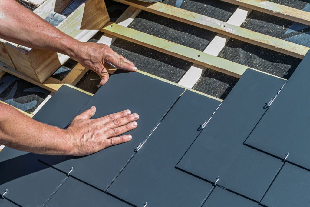 craftsmen installing slate tiles