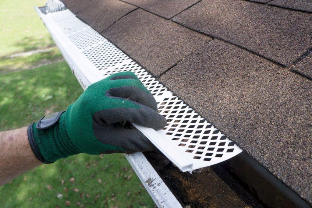 hand installing gutter guard