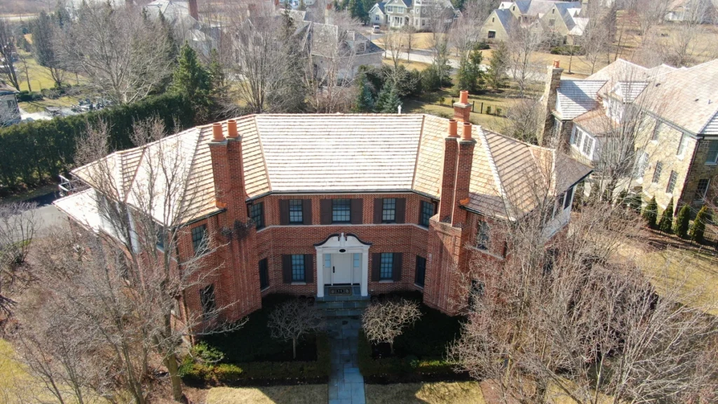 large brick home with cedar shake shingles in Lake Forest, IL