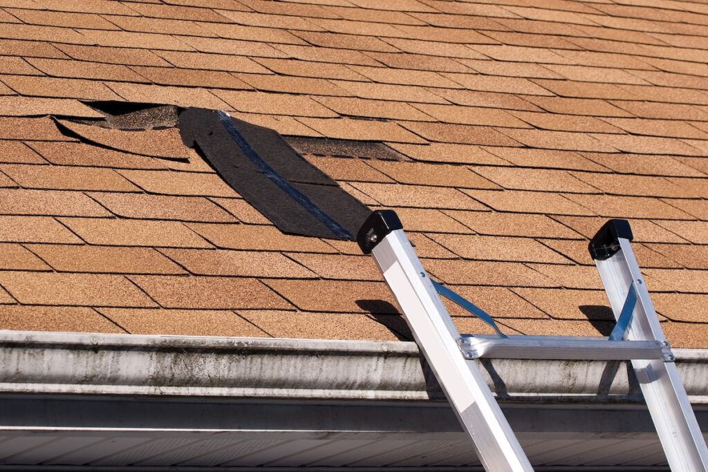 Fixing damaged roof shingles