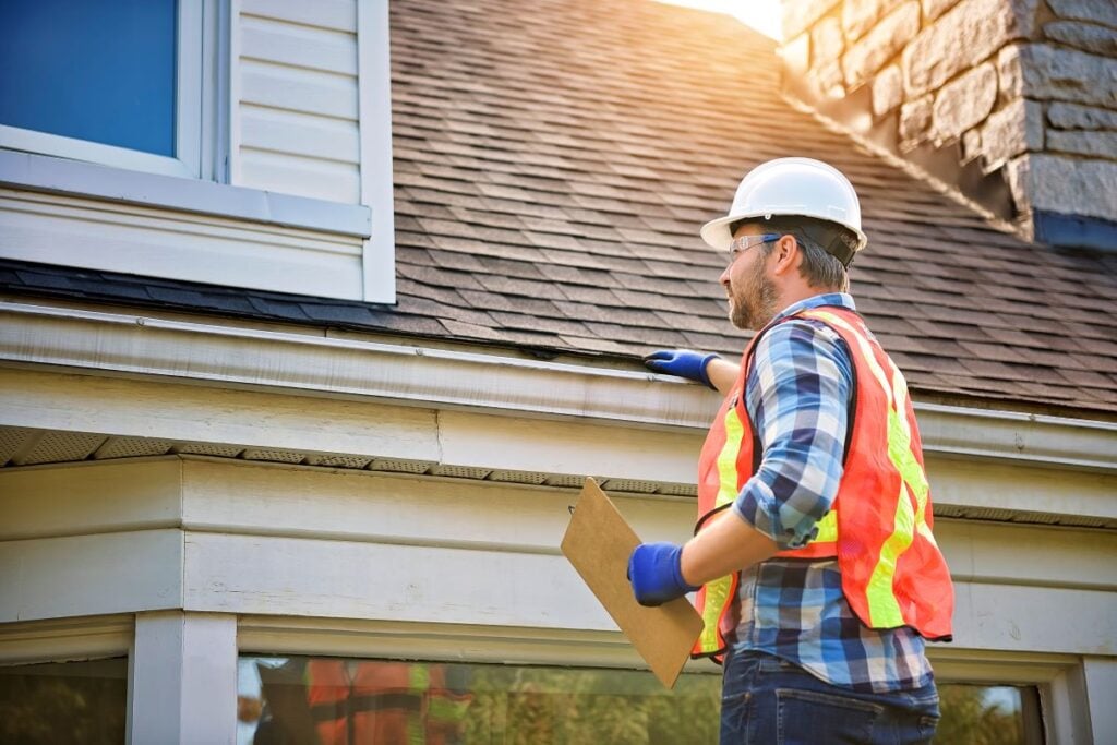 Man inspecting roof