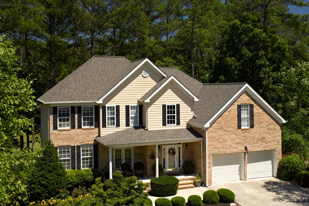 brick house with asphalt shingle roof in fox point wi